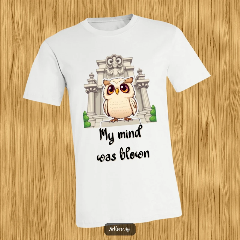 Funny owl t-shirt depicting a surprised owl with large eyes looking up at a grand statue, capturing a moment of awe.